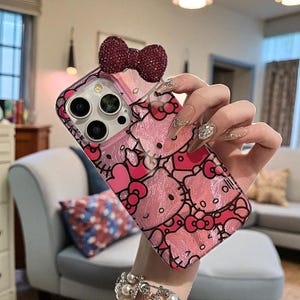 Hello Kitty iPhone Hülle: Glitzernde Hartcover-Hülle mit 3D Schleifen-Anhänger A
