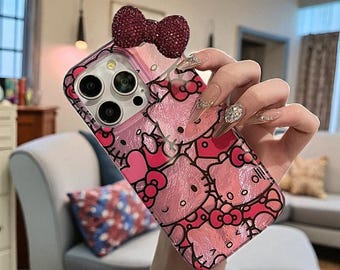 Funda para iPhone de Hello Kitty: carcasa rígida con purpurina y lazo 3D