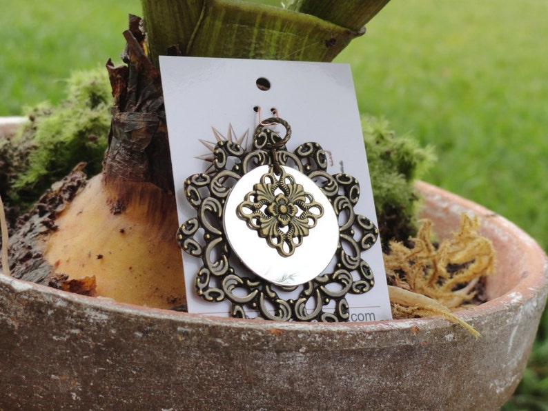 Surprise pendant in antique gold and shiny silver Style #1345B