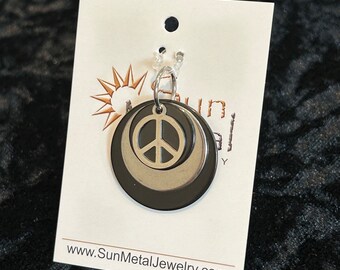 What the world needs now black and stainless steel peace pendant (Style #1513)