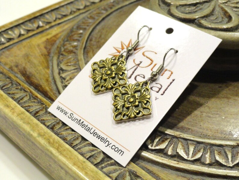 Surprise pendant in antique gold and shiny silver Style #1345B