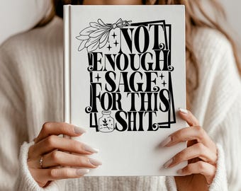May include: A white hardcover book featuring black text that reads NOT ENOUGH SAGE FOR THIS SHIT. The design includes a graphic of a sage bundle, small stars, and a small jar with a sprig inside, all enclosed within a rectangular frame.