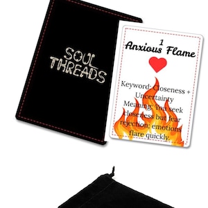May include: Black velvet pouch and card set from Soul Threads. The card features the text "Anxious Flame" with a heart and flames graphic. Keywords: Closeness + Uncertainty. Meaning: You seek closeness but fear rejection; emotions flare quickly.