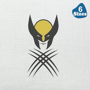May include: A black and yellow Wolverine mask graphic with crossed claws on a white background. A blue oval with the text "6 Sizes" is in the upper right corner. The design is likely for apparel or accessories.