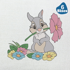 May include: A cartoon illustration of a grey rabbit holding a pink flower, with other colourful flowers around it. The image includes the text "6 Sizes" in a blue shape.