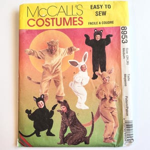 May include: McCall's Costumes Easy to Sew pattern 8953 in size medium. The envelope features illustrations of five different animal costumes including a lion, a rabbit, a bear, a cat, a leopard, and a kangaroo, all with hoods and tails.