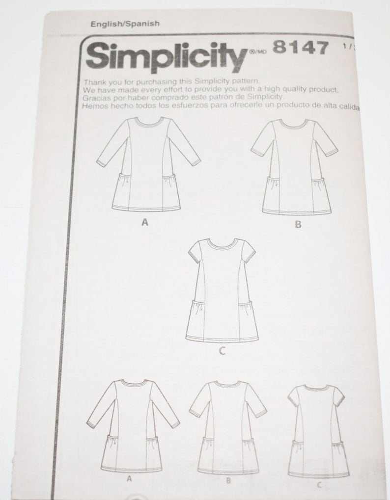 May include: Simplicity 8147 sewing pattern. The pattern features illustrations of dresses with long, three-quarter, and short sleeves, each with pockets. The text includes "Thank you for purchasing this Simplicity pattern."