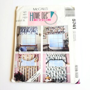 May include: A McCall's Home Dec In-A-Sec sewing pattern envelope, number 5741, featuring four distinct window treatment designs. The cover displays illustrations of valances and curtains in various floral and solid fabric patterns for home decor.