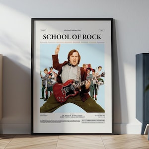 Op de afbeelding: Ingelijste poster voor de film "School of Rock" met Jack Black die een rode elektrische gitaar bespeelt. De poster heeft een lichtblauwe achtergrond met de filmtitel bovenaan en een groep kinderen op de achtergrond.