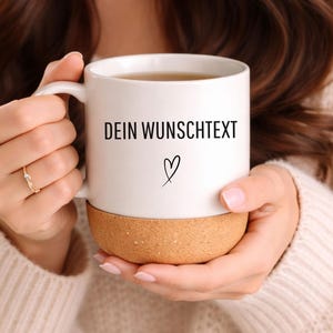 May include: A white ceramic mug with a black handle and the text "But First, Coffee" in a black, bold font. The mug is on a white surface.