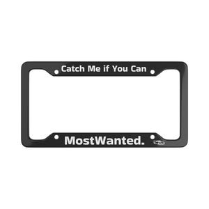 May include: Black license plate frame with the text "Catch Me if You Can" at the top and "MostWanted." at the bottom. A small car graphic is on the bottom right corner. The frame is rectangular with rounded corners.