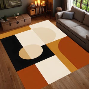 May include: Geometric patterned area rug featuring a modern design. The rug incorporates a palette of black, cream, tan, and burnt orange. The design includes squares, circles, and curved shapes, creating a contemporary aesthetic. The rug is placed on a hardwood floor.
