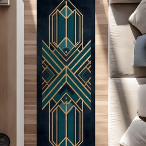 May include: A rectangular rug with an Art Deco design. The rug has a dark teal background with gold geometric patterns. The design includes vertical and horizontal lines, creating a symmetrical and stylish look. The rug is placed on a wooden floor.