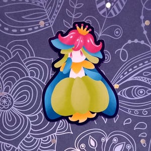 May include: A cartoon illustration of a green, yellow, and blue flower wearing a crown. The flower has a pink flower on its head and is wearing a yellow dress.