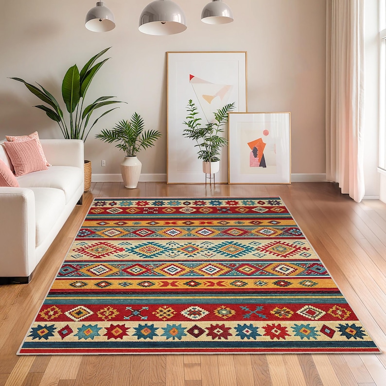 May include: A rectangular rug with a Southwestern design. The rug features a vibrant mix of colours, including red, yellow, turquoise, and cream, arranged in geometric patterns and stripes. The rug is placed on a hardwood floor.