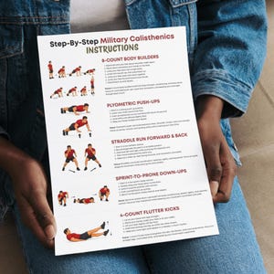 May include: A white sheet of paper titled "Step-By-Step Military Calisthenics INSTRUCTIONS" is held. It contains illustrated instructions for exercises like body builders, push-ups, and flutter kicks, designed for fitness training.