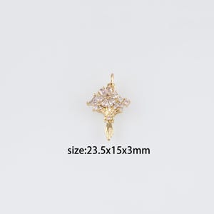 May include: Gold-toned pendant charm featuring a bouquet of white cubic zirconia stones. The pendant is 2.35 inches tall, 1.5 inches wide, and 0.3 inches thick.  size:23.5x15x3mm