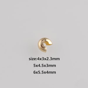 May include: A single gold-colored jewelry finding, a curved C-shape with a small opening. The image includes text indicating sizes: 4x3x2.3mm, 5x4.5x3mm, and 6x5.5x4mm. The background is a solid, neutral color.