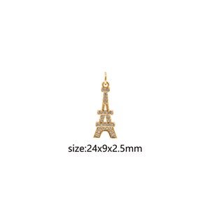 Può includere: Ciondolo Torre Eiffel color oro con accenti di cristallo trasparente. Dimensione: 24x9x2,5 mm.