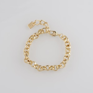 May include: Gold-toned chain bracelet with a lobster clasp closure. The bracelet features a series of interconnected, rounded links. A small, rectangular charm is attached near the clasp. The bracelet is displayed on a white background.