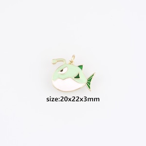 May include: A gold-colored metal pendant in the shape of a cartoon fish. The fish has a light green body, white belly, and green fins. The pendant measures approximately 0.79 x 0.87 x 0.12 inches. The text "size:20x22x3mm" is below the pendant.