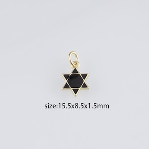 May include: Gold-tone pendant charm featuring a black enamel Star of David. The charm measures 15.5mm x 8.5mm x 1.5mm.