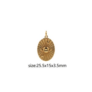 May include: Gold-toned pendant featuring a detailed design of a planet with rings and stars. The pendant is oval-shaped and measures 25.5 x 15 x 3.5 mm.