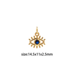 Könnte beinhalten: Goldener böser Blick-Anhänger mit einem blauen Edelstein. Der Anhänger ist 14,5 mm breit, 11 mm hoch und 2,5 mm dick.