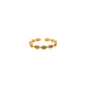 May include: Gold adjustable ring featuring a row of evil eye charms with blue and white stones.