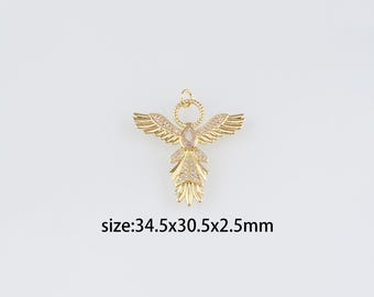 May include: Gold-tone angel pendant with clear crystal accents. The pendant measures 34.5 mm x 30.5 mm x 2.5 mm.