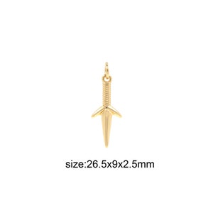 May include: Gold-toned pendant shaped like a dagger with a textured surface. The pendant measures 26.5 mm x 9 mm x 2.5 mm.