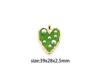 May include: A gold heart-shaped pendant with a green enamel fill and white pearl accents. The pendant measures 39x28x2.5mm.
