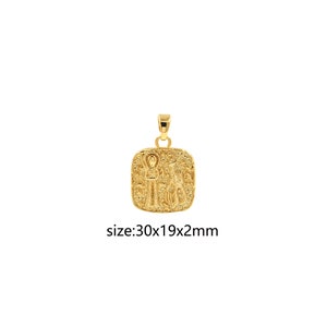 May include: Gold pendant with a square design featuring an embossed image of a person and an animal. The pendant measures 30x19x2 mm.