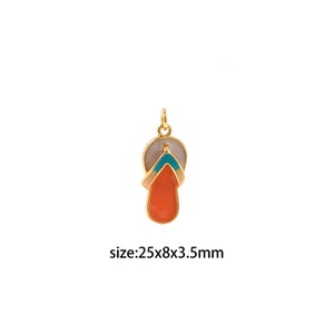 May include: Gold-tone charm shaped like a flip-flop with orange, blue, and white enamel. Size: 25x8x3.5mm.