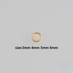 May include: A single gold-coloured jump ring, centred on a light grey background. The text below the ring indicates available sizes: 3mm, 4mm, 5mm, and 6mm. Suitable for jewellery making and crafting projects.