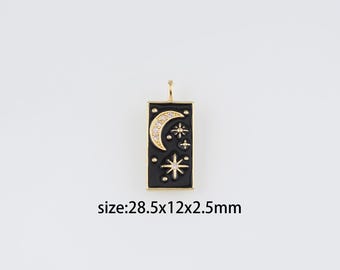 May include: Gold-tone pendant charm with a black enamel rectangle featuring a crescent moon and stars with clear rhinestones. Size: 28.5x12x2.5mm.