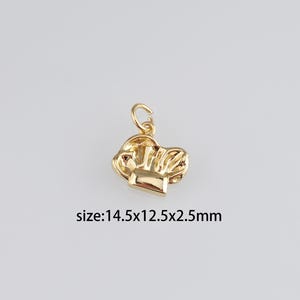May include: Gold-toned chef hat charm pendant. The charm is approximately 1.45 inches wide, 1.25 inches tall, and 0.25 inches thick.  size:14.5x12.5x2.5mm