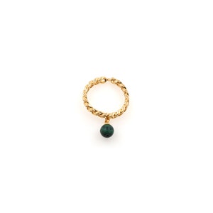 May include: A gold ring with a twisted band and a dangling green malachite stone.