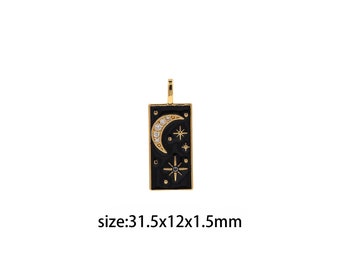 May include: Gold pendant with a black enamel rectangle featuring a crescent moon and stars with clear and black rhinestones. The pendant measures 31.5 x 12 x 1.5 mm.