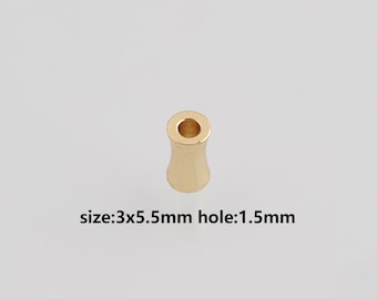 May include: A small, gold-colored bead with a flared shape. The bead has a hole through the center. The text on the image reads: size:3x5.5mm hole:1.5mm.