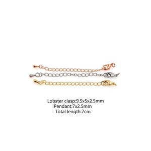 May include: Three extender chains for necklaces or bracelets. The chains are 7 cm long and feature a lobster clasp and a pendant. The chains are available in silver, gold, and rose gold.