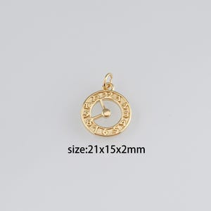 May include: Gold-toned clock charm with Roman numeral markings and a size of 21x15x2mm.