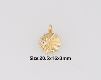 May include: Gold-colored pendant with a sunburst design and a central clear gemstone. The pendant measures approximately 20.5 x 16 x 3mm. The pendant has a loop for attaching to a chain or other jewelry.