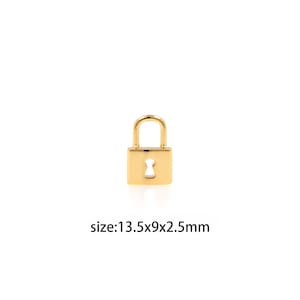 May include: A small gold padlock charm with a keyhole. The charm measures 13.5 x 9 x 2.5 mm.