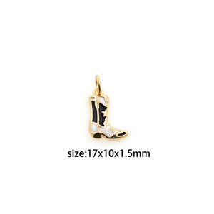 May include: Gold-tone charm in the shape of a white and black cowboy boot. The charm is 1.7 cm x 1 cm x 1.5 cm.