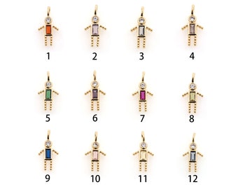 May include: Twelve gold charms in the shape of a stick figure with a single gemstone in the center of the body. The gemstones are in various colors, including red, purple, green, pink, blue, and clear.