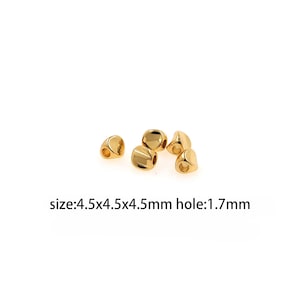 May include: Gold-colored metal beads with a hole in the center. The beads are 4.5 mm x 4.5 mm x 4.5 mm and the hole is 1.7 mm.  size: 4.5x4.5x4.5mm hole: 1.7mm
