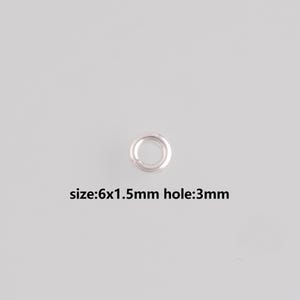 May include: A single silver-colored metal eyelet with a circular design. The eyelet measures 6x1.5mm with a 3mm hole. The eyelet is shown against a light gray background. The text "size:6x1.5mm hole:3mm" is below the eyelet.