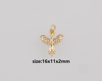 May include: Gold-colored phoenix pendant with a detailed design and small, clear gemstones. The pendant is 16mm long, 11mm wide, and 2mm thick. The phoenix has outstretched wings and a detailed tail. The pendant has a loop at the top for attaching to a chain.