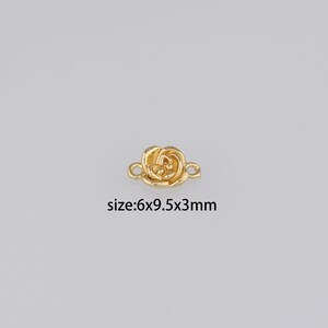 May include: Gold-toned rose flower connector charm with two loops for attaching jewelry. Size: 6x9.5x3mm.